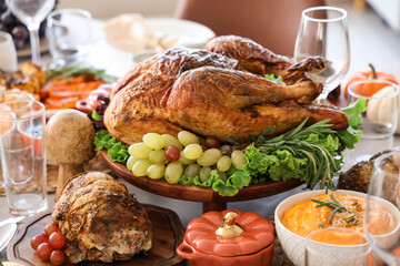 Festive table setting with tasty food for Thanksgiving Day in room, closeup