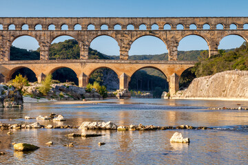 Pont du Gard Roman Aqueduct, Languedoc-Roussillon, France, in early autumn. This was built by the Romans in the first century CE to carry water from Uzes to Nimes.