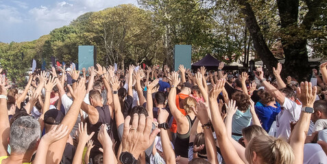 runners hands up before running in lake run ioannina city greece