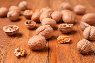 Natural walnuts on wooden background