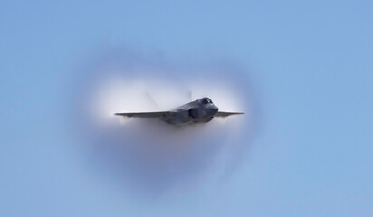 Fighter Jet with fog on the wing