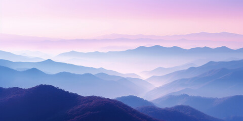 Fototapeta premium The mountains are shrouded in mist, and the last traces of daylight lend a tranquil, mystical quality to the scene. A twilight shot of autumn mountains under a fading pink and purple sky.
