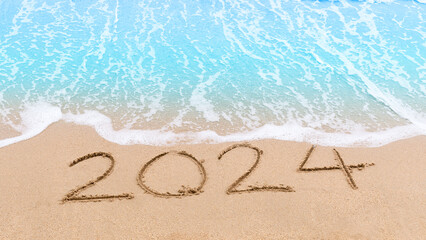 2024 new year goals planning concept. Numbers 2024 on brown sand and blue ocean waves. Top view.Investment in 2024. Copy space for your design or text. Wallpaper background - obrazy, fototapety, plakaty