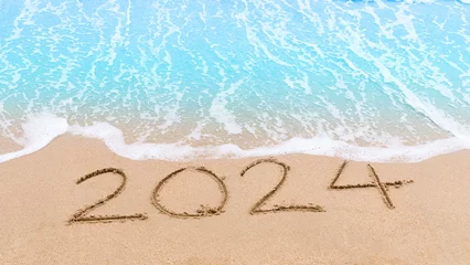Foto op Canvas 2024 new year goals planning concept. Numbers 2024 on brown sand and blue ocean waves. Top view.Investment in 2024. Copy space for your design or text. Wallpaper background © HappyBall3692