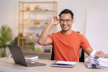 Happy business man work on laptop for email update, online project and reading digital report with...