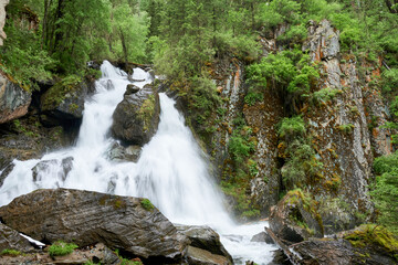 Waterfall in the forest. Russia, Siberia, Altai mountains.