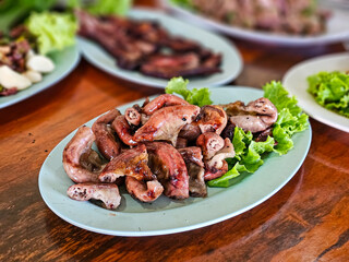 Grilled pork intestine served with spicy sauce, Northeastern region of Thailand (Jaew sauce). Isaan Food, Thai street Food. Thai local street food by home cooking chef