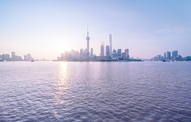 financial district buildings of shanghai and the yacht docked at the dock