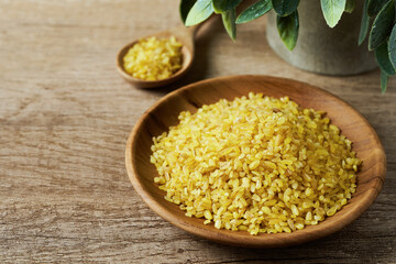 bulgur durum wheat on wood table rustic background. bulgur durum wheat on wood table. bulgur durum wheat on wood table food background
