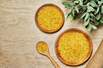 top view flat lay bulgur durum wheat on wood table rustic background. bulgur durum wheat on wood table. bulgur durum wheat on wood table food background