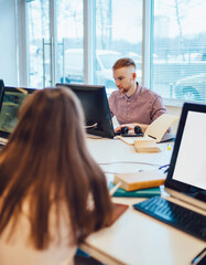 Serious fellows reading in library