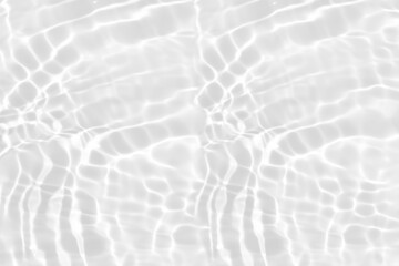 Defocus blurred transparent white colored clear calm water surface texture with splashes reflection. Trendy abstract nature background. Water waves in sunlight with copy space. Blue watercolor shine.