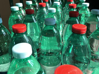water bottle with colored caps arranged in a row
