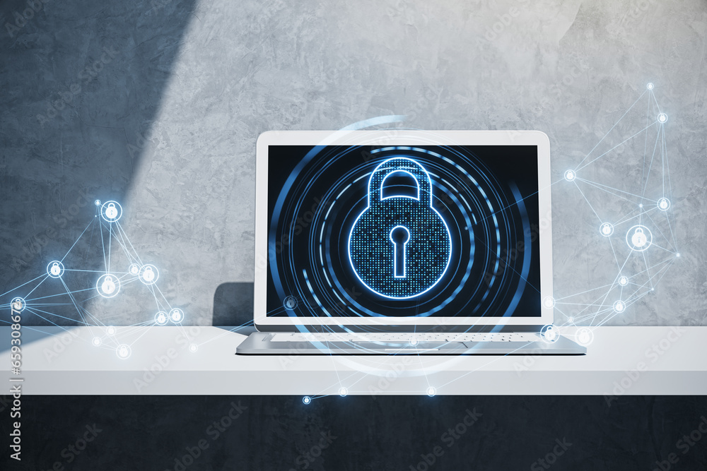 Poster close up of laptop on desk with glowing polygonal padlock hologram on concrete wall background. secu