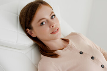 Naklejka premium Young woman having laser hair removal procedure in cosmetic center. Removes pigmentation in cosmetic clinic. Intensive Pulsed Light Therapy. Anti-aging treatments.