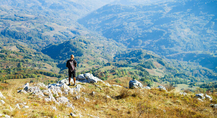 Hikers on the peaks enjoy a scenic nature landscape view.