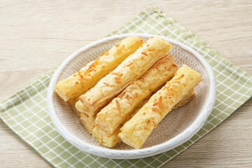 Cheese Stick Pastry served on white bowl
