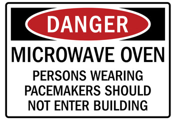Fototapeta premium Pacemaker and magnetic hazard warning sign and labels microwave oven. Persons wearing pacemakers should not enter building