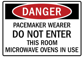 Obraz premium Pacemaker and magnetic hazard warning sign and labels pacemaker wearer do not enter this room. Microwave ovens in use