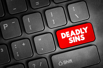 Deadly sins text button on keyboard, concept background