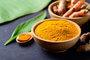 Turmeric powder and fresh turmeric (Curcuma, curcumin), Food ingredient in Asian cuisine