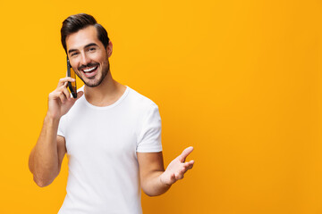 Smiling man phone cyberspace phone copy smartphone space mobile communication yellow happy portrait