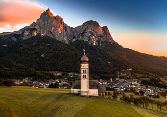 Seis am Schlern, Italy - Aerial view of St. Valentin Church and famous Mount Sciliar mountain at...