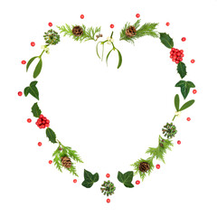 Romantic Christmas heart shape wreath with holly, mistletoe and winter greenery. Traditional nature symbol for the festive holiday season on white background. 