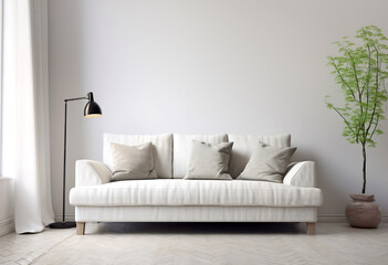 White sofa, black floor lamp and potted branch against white wall with copy space. Minimalist, scandinavian home interior design of modern living room.
