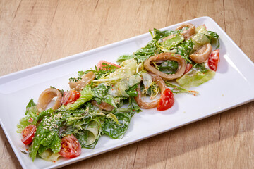 caesar salad on the plate