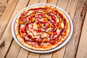 tasty pizza on the wooden background