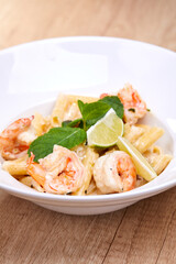 pasta with shrimps  in white plate