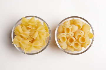 macaroni inside a glass bowl on a white background seen from above