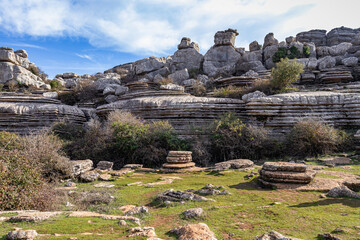 Torcal de Antequera National Park with its limestone rocks, beautiful nature and Iberian wild goats, Andalusia, Spain - obrazy, fototapety, plakaty