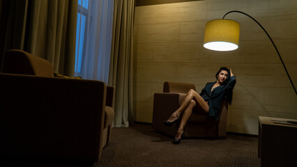 Indoor shot of sexy young woman. Portrait of beautiful informal girl dressed in black underwear,...