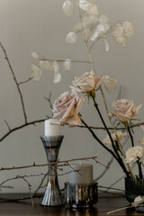 Stylish table decoration with roses, lunarium, candles