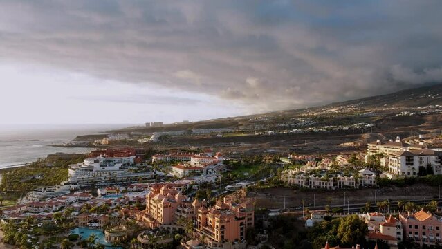 Beautiful aerial view of Tenerife island, Spain, Canary Islands. Time lapse. Сity, clouds and mountains.