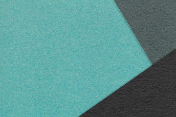 Texture of craft cyan color paper background with green and black border. Vintage abstract cardboard.