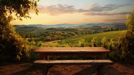 Fotobehang Toscane empty wooden table on the background of vines, tuscan landscape at sunrise