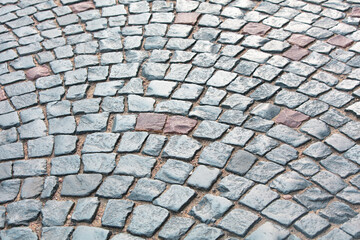Stone pavement on the sidewalk as an abstract background. Texture
