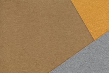Fototapeta premium Texture of craft brown color paper background with yellow and gray border. Vintage abstract ocher cardboard.