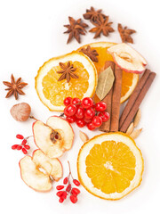 Christmas spices - cinnamon, anise, nuts, apples and dried orange slices