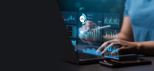 Female analyst uses Work on laptop and dashboard for business analysis, data and data management system with KPIs and indicators connected to database for technology finance. Corporate strategy