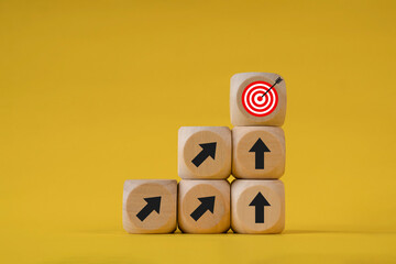 Business growth goals and success goals Scattered wooden blocks with arrow icons and red target icons. Business target or goal success and winner concept.