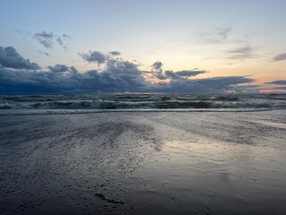 Cloudy seascape, sea shoreline, sunset time