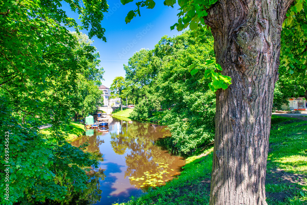 Sticker Riga, Latvia - July 7, 2017: City park and river