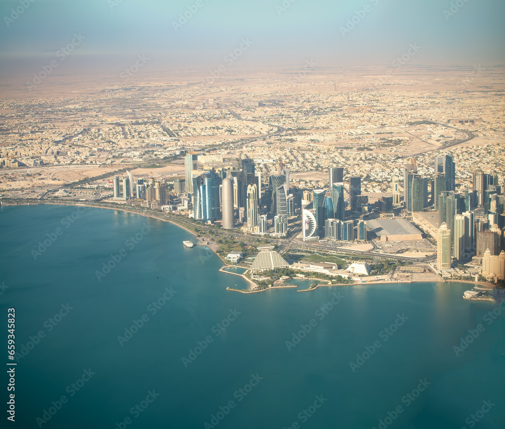 Sticker aerial view of doha skyline from airplane. corniche and modern buildings, qatar