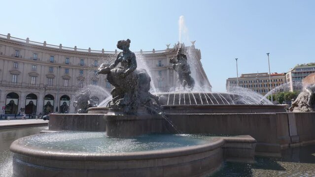 Fountain of the Naiads in the center of "Piazza della repubblica" in Rome.  At the center is Glaucus, a Greek prophetic sea-god. Orbital move. North East part of Porticos in the background.