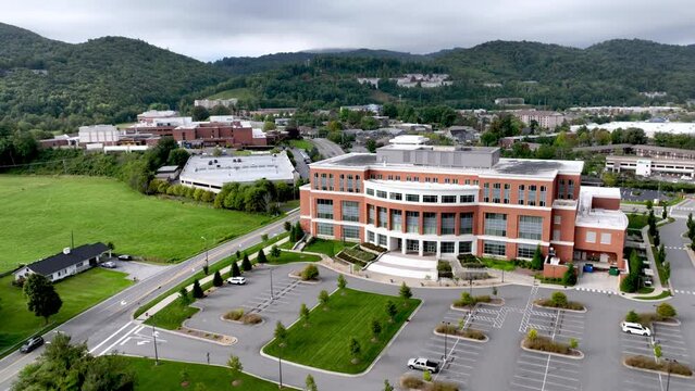 aerial pullout over appalachian state university medical building with appalachian healthcare system in the background in boone nc, north carolina