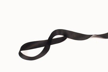 Naklejka premium photo of black ribbon, ribbon for mourning on a white background